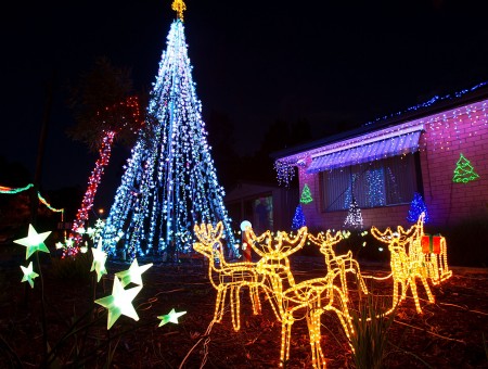 Yellow Christmas Lights Reindeer Statues