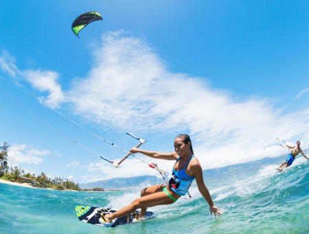 Woman Kitesurfing On An Ocean