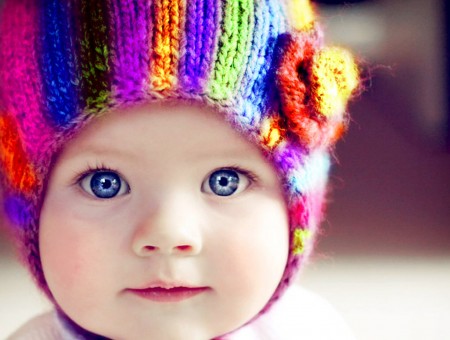 Rainbow Knitted Beanie With A Flower