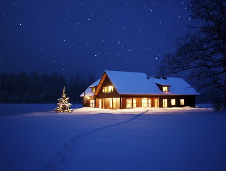White And Brown House With Light On Snow Field During Nighttime