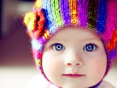 Baby In Blue Orange And Green Knit Cap