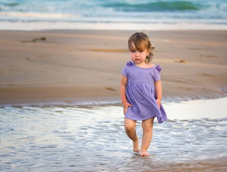 Girl In Purple Mini Dress Standing On Water During Daytime