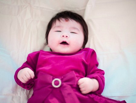 Infant In Purple Suede Dress