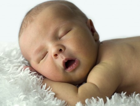 Topless Baby Sleeping On White Textile