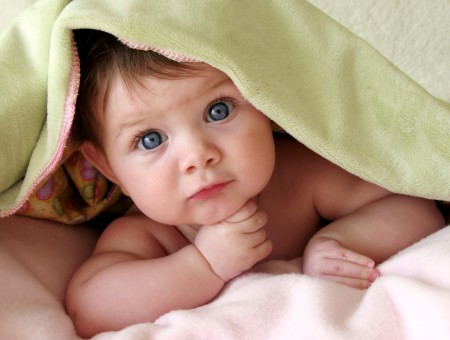Baby Under Green Blanket