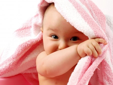 Baby Covered By Pink And White Terry Textile