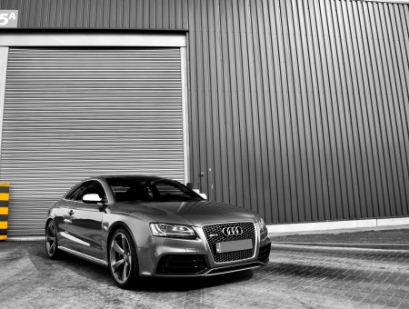 Gray Audi Coupe In Front Of Garage During Daytime