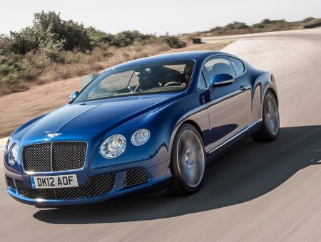 Blue Bentley Continental On The Road During Daytime