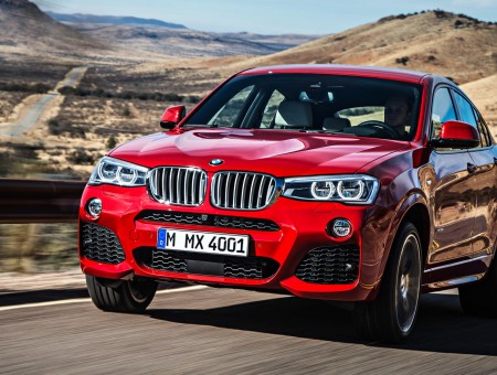 Red BMW X6 On Road During Daytime