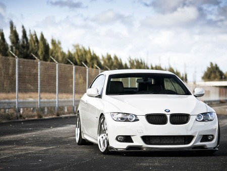 White BMW On Grey Cement During Daytime