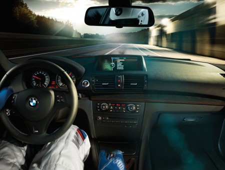 Person Driving Black BMW Car Interior