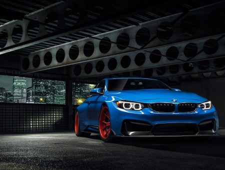 Blue BMW Car On Gray Concrete Floor
