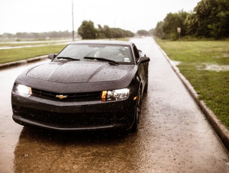 Black Chevrolet Car On Road During Rainy Day At Daytime