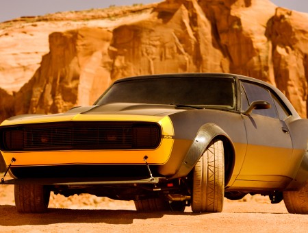 Grey And Yellow Muscle Car In The Desert