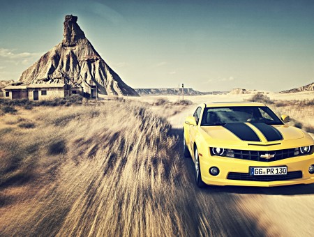 Yellow And Black Chevrolet Camaro Z28 On Paved Road