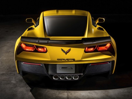 Yellow And Black Chevrolet Corvette Car On Black Pavement