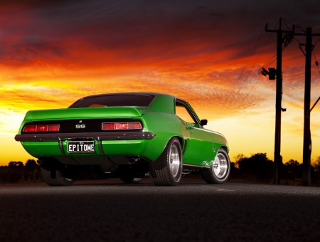 Green Classic Camaro Ss On Road During Night Time