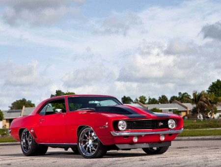 Red And Black Muscle Car On Road
