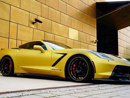 Yellow Sports Car Parked Beside Building