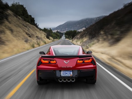 Red Sports Car In Highway During Daytime