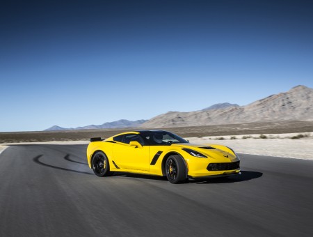 Yellow Black Coupe On Gray Rolled Asphalt Road Under Blue Sky During Daytime