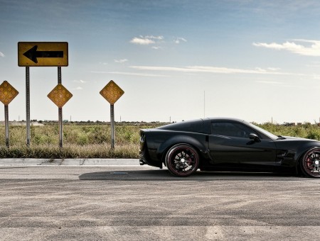 Black Sports Car On Road During Daytime