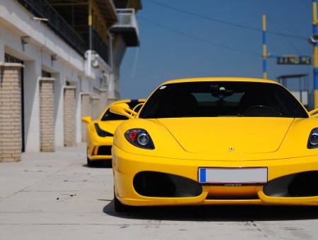 2 Yellow Sport Cars On Street