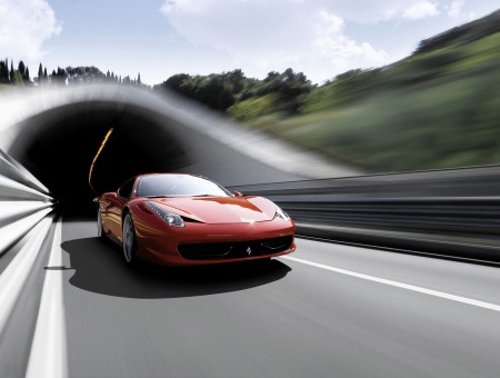 Orange Sports Car Heading Out Of Tunnel