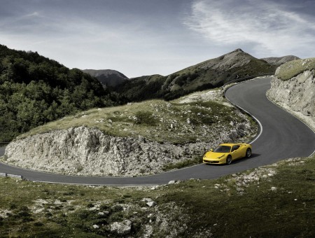 Yellow Sports Car Traveling On Road