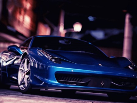 Blue Ferrari 458 Italia On Paved Road During Night Time