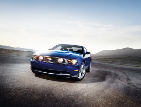 Blue Ford Mustang On The Road During Daytime