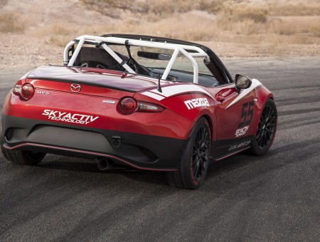 Red Skyactiv Technology Racecar On A Paved Road
