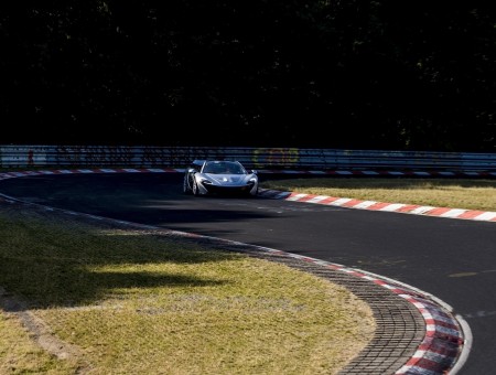 Grey McLaren P1 On Race Track