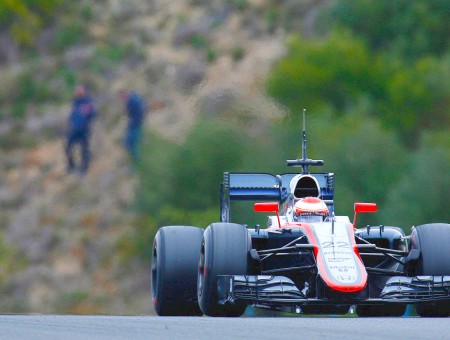 Red White And Black F1 Car On Track