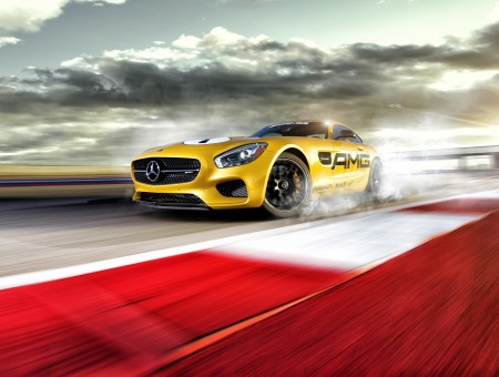 Yellow Mercedes Benz AMG Coupe On Track