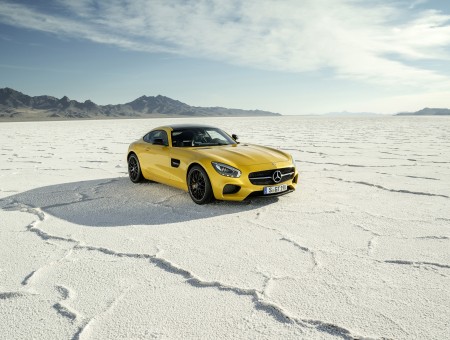 Yellow Mercedes Benz SLS AMG On Snowfield