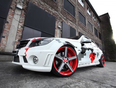 White Gray Red And Black Sports Car Next To Building