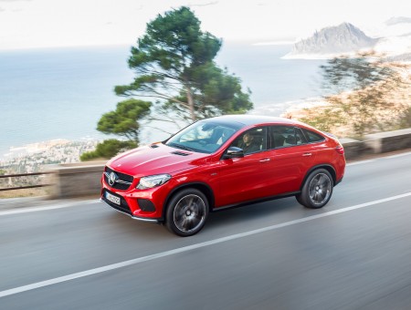 Red Mercedes Benz GLE Class On Road During Daytime