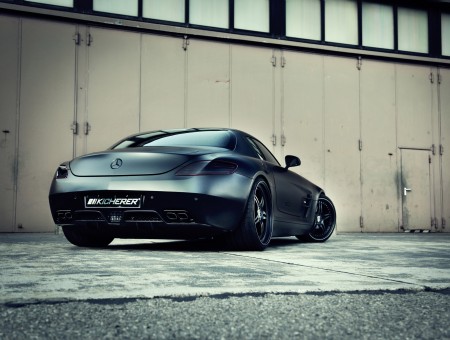 Grey Mercedes Benz Sports Car Parked Beside White Wall