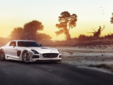 Gray Mercedes Benz SLS AMG On Road During Sunset