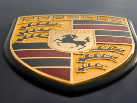 Yellow Red And Black Porsche Emblem