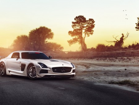 White Mercedes Benz SLS AMG On Road During Sunset