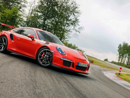 Red Porsche 911 Turbo S Parked On Tarmac