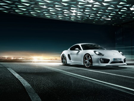 White Sports Car Traveling On Road