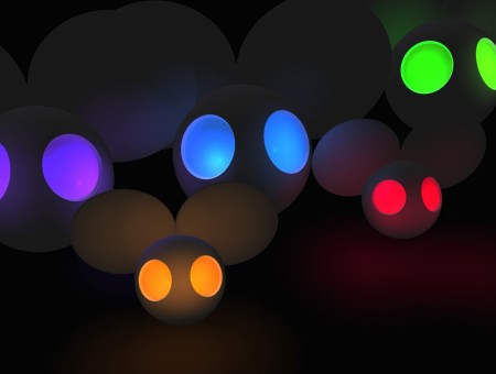 White Round Balls With Blue Green Purple And Red Eyes Light