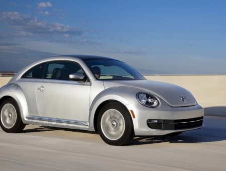 Silver Volkswagen Beetle In The Road During Daytime