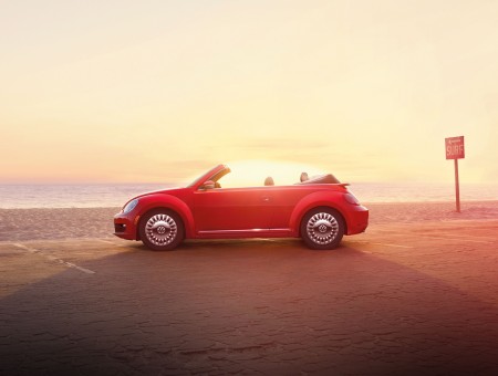 Red Convertible VW Beetle On Road During Daytime