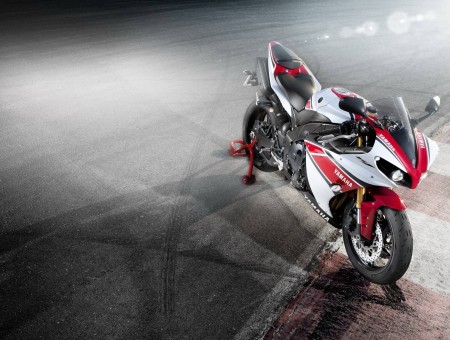 White Red And Black Yamaha R1 On Race Track During Nighttime