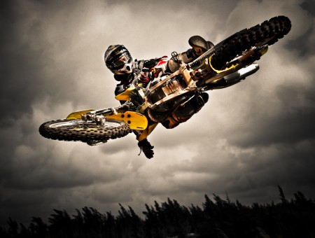 Selective Color Photography Of Man Riding Dirt Bike