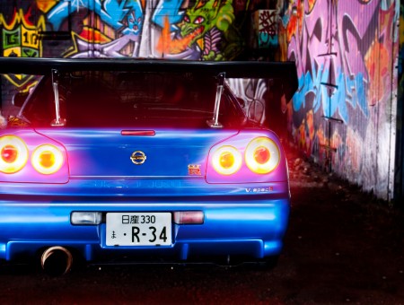 Blue Nissan Skyline Gtr In Garage With Graffiti Arts